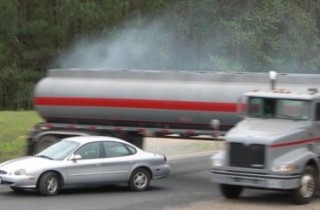 Car tries to evade a jackknife truck accident